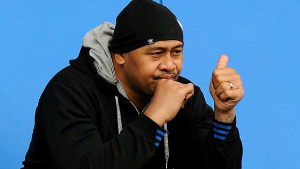 All Blacks great Jonah Lomu, gives a thumbs up as he watches the Wallabies train.