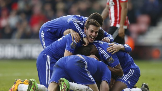 Chelsea players celebrate after Branislav Ivanovic scores.