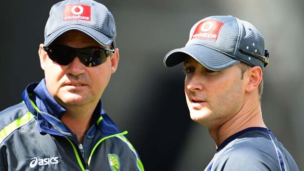 "Meat in the sandwich": Mickey Arthur (left) claims he was drawn into the feud between Michael Clarke (right) and Shane Watson.
