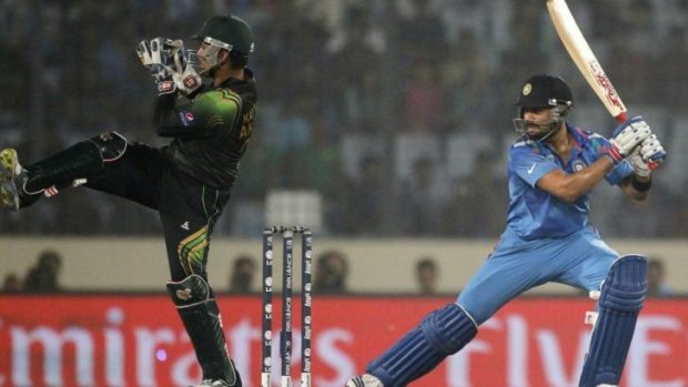 Virat Kohli steered India home in World Twenty 20 opener against Pakistan.
