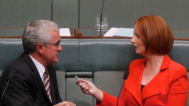 Prime Minister Julia Gillard talks with Independent MP Andrew Wilkie.