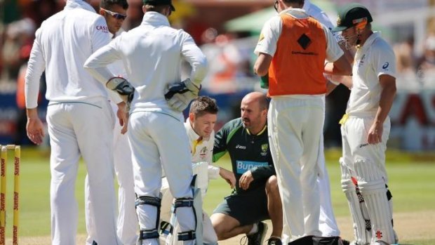Michael Clarke receives treatment after withstanding a pace barrage from South African fast bowler Morne Morkel. Scans have since revealed he suffered a fractured shoulder.