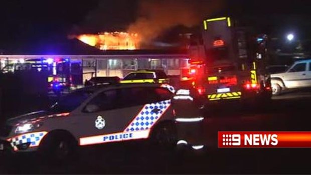 Police at a blaze at stables near the Gold Coast Turf Club.