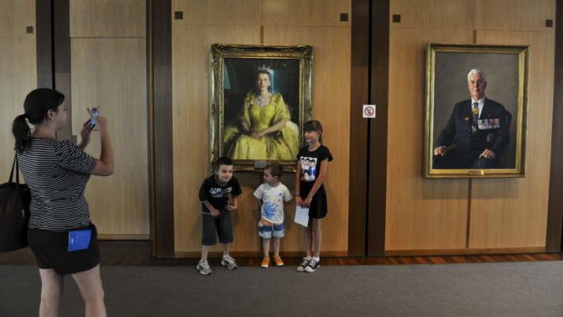 No barrier ... Gundaroo visitors the George family, James, 7, Logan, 4 and Chloe, 9, pose for a photo for their mother, Nicola, in front of the Queen.
