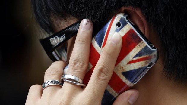 A man talks on a mobile phone in Hong Kong.