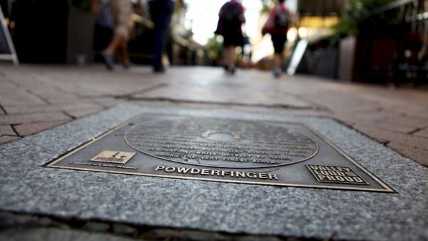 Powderfinger's plaque on the Brisbane music hall for fame in the Brunswick Street Mall pavers.