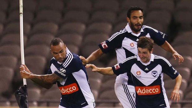 Archie Thompson celebrates after scoring the second goal for his team in extra-time against Perth Glory.