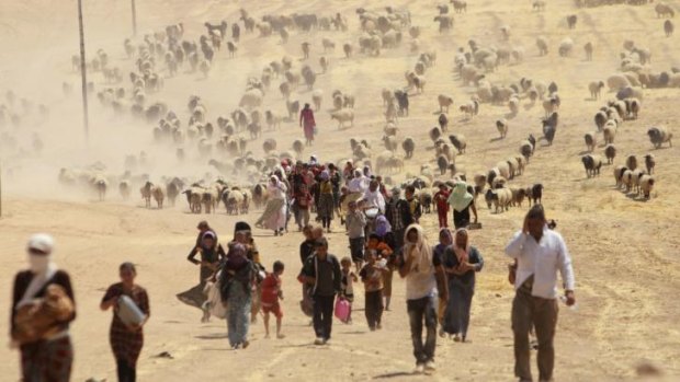 Fleeing for their lives: Yazidis try to get away from the violence of the Islamic State.