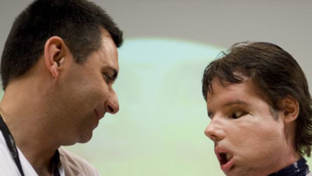 Recovering well ... Doctor Joan Barret and the patient known as Oscar, who had a full face transplant in Spain.