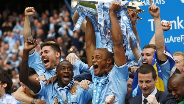 Manchester City players celebrate their second Premier League title in three years.