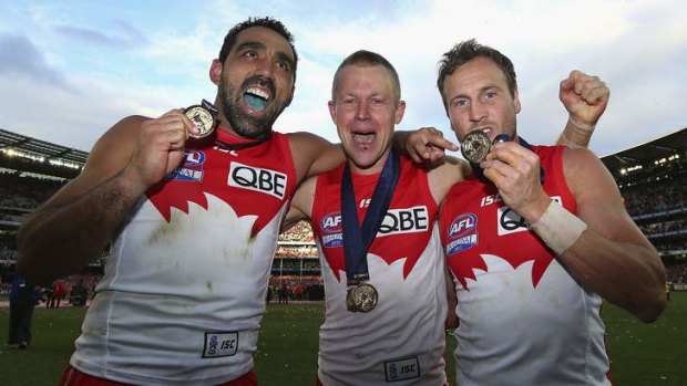 Victorious: Adam Goodes, Ryan O'Keefe and Jude Bolton celebrate winning the 2012 AFL Grand Final over Hawthorn.