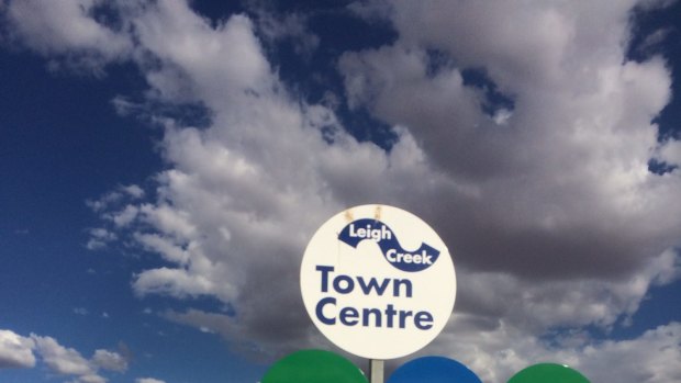 New signs at the entrance of mining town Leigh Creek, in South Australia, suggest the town is open for business.