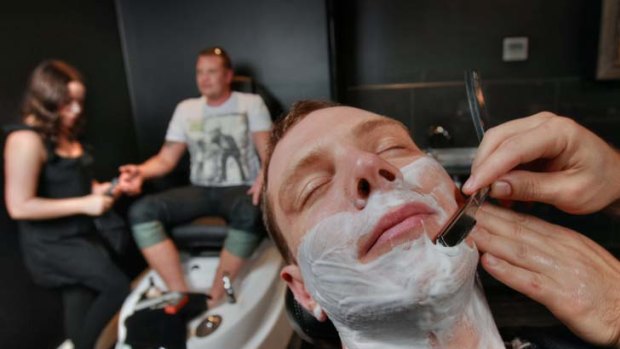 David Arkeveld (front) and his brother and best man Benedict map up the pampering at Manhor Men's Grooming Lounge.