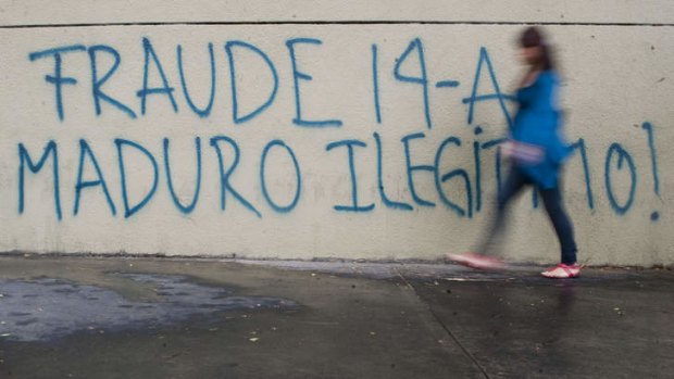Graffiti in Caracas accuses Mr Maduro of being an illegitimate president.