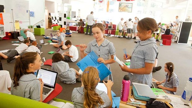 In the zone: six teachers interact with up to 180 children in the big classroom where years 5 and 6 spend much of their week at the Northern Beaches Christian School.