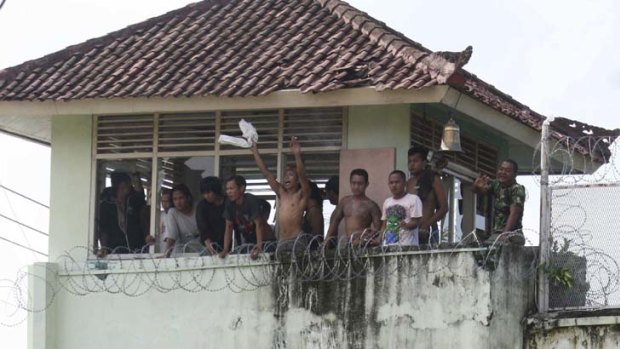 Overcrowded &#8230; inmates overlooking a balcony at Denpasar's Kerobokan prison, where rubber bullets were fired by police.