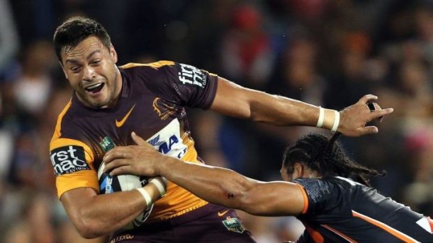 Brisbane's Alex Glenn tries to break clear of the Tigers' defence.