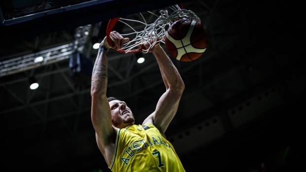 Australia's Mitch Creek dunks against China at the FIBA Asia Cup.