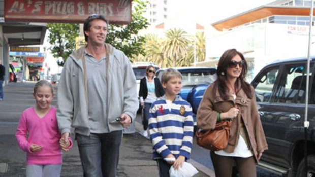 A family affair ... Glenn McGrath, fiancee Sara Leonardi and his children, Holly and James, shopping in Cronulla yesterday.