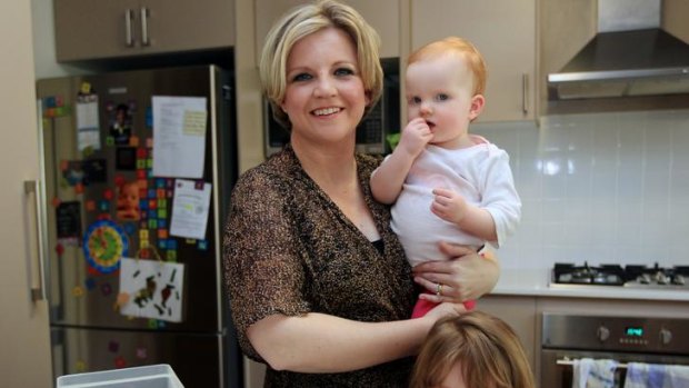 Priorities straight ... it is possible to be a working mum like Samantha Baker, with baby Georgina and Ella, 4.