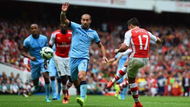 Arsenal's Alexis Sanchez scores his team's second goal against Manchester City on Saturday.
