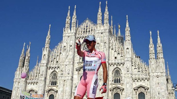 Top gun: Backed by the Duomo Cathedral, Spaniard Alberto Contador gives his traditional pistol shot gesture after winning the Giro d'Italia.