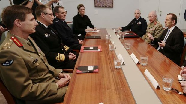 Prime Minister-elect Tony Abbott meets with Defence chiefs, including Major-General Angus Campbell (left), at Parliament House on September 11.