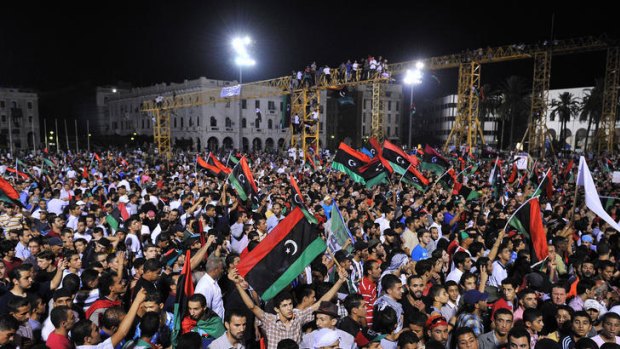 Thousands celebrate the rebels’ success in Tripoli’s Martyrs Square.