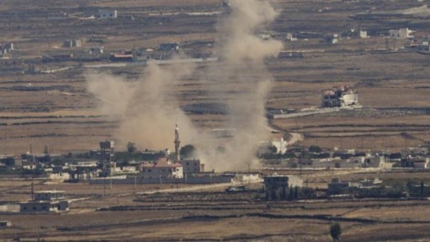 Smoke rises following an explosion in Syria's Quneitra province as rebels clashed with President Bashar al-Assad's forces, seen from the Golan Heights, on Thursday.