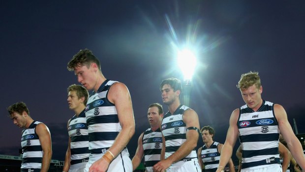 Steve Johnson and dejected Cats leave the ground on Saturday after their third loss this season. 