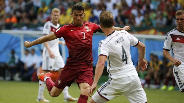 Portugal's Cristiano Ronaldo looks to take a shot on goal as Germany's Benedikt Hoewedes closes down the threat. Ronaldo has only scored two World Cup goals in his career.