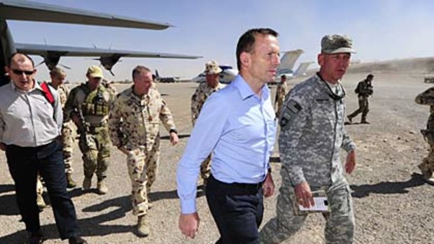 Opposition Leader Tony Abbott is greeted by the Commander of Combined Team Uruzgan, Colonel Jim Creighton, on arrival at Tarin Kowt.