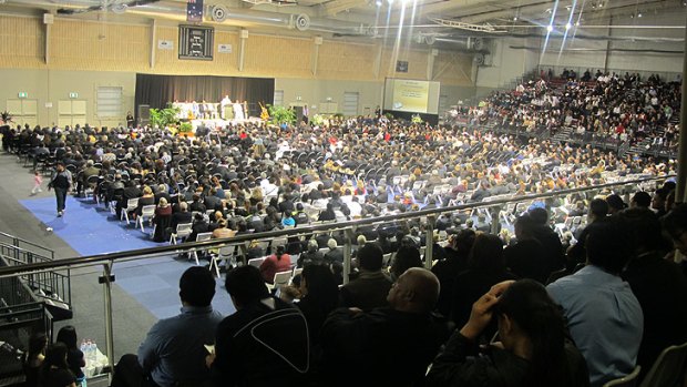 Four thousand mourners gather to pray for the victims of the Slacks Creek fire.