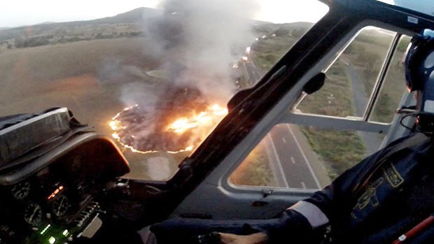 A truck burns at Glenwood, north of Gympie, as seen from the air.