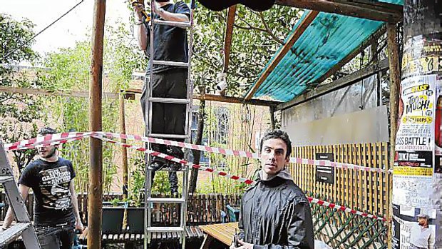 The pergola at the Black Cat cafe in Fitzroy is demolished.