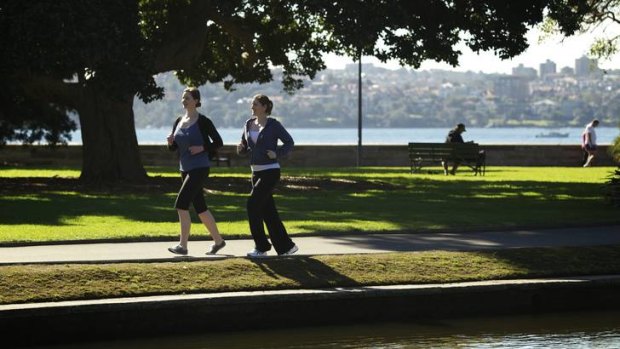Step by step ... Esme O'Neill-Dean, left, and Julie Wells, leave the emails behind on their daily jog through the Botanic Gardens.