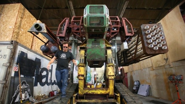 Megabots co-founder Gui Cavalcanti with his Mk II robot at the company's headquarters in Oakland, California.