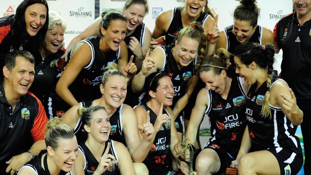 Ecstasy: Townsville Fire celebrate their WNBL title in March.