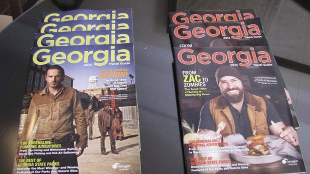 Two covers of the travel guide issued by the states of Georgia feature the TV show The Walking Dead.