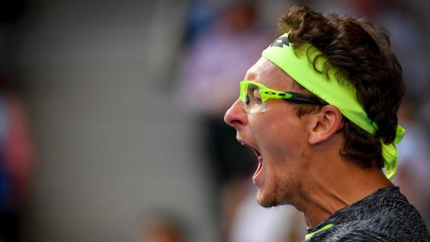 Denis Istomin with his green fluoro glasses and matchy-matchy bandana.
