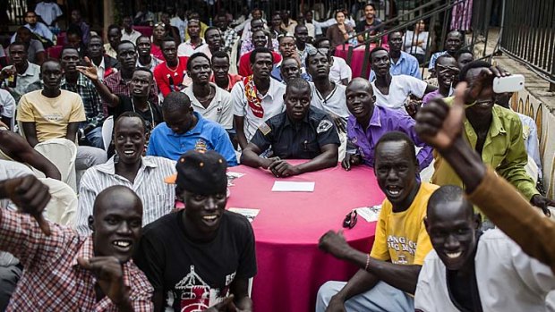 A South Sudanese crowd cheer during a fight at the the International Kickboxing Challenge in Juba.