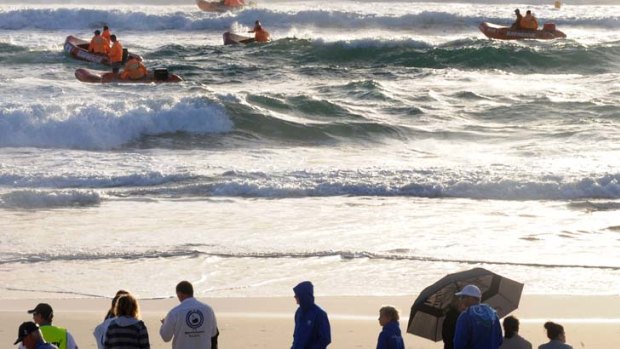 Heart-breaking search &#8230; surf rescue teams scour Kurrawa beach after Matthew Barclay went missing on Wednesday.