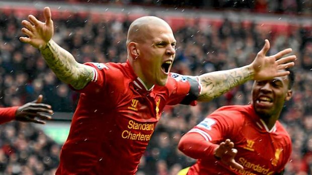 On fire: Martin Skrtel of Liverpool celebrates scoring the opening goal against EPL leaders Arsenal in the opening minute at Anfield.