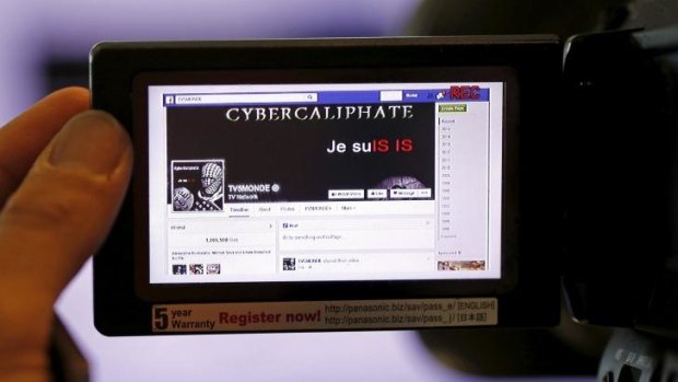 'Je suis IS' ... A print screen of the hacked Facebook page of French television network TV5Monde is seen on a camera viewer in Paris on Thursday.