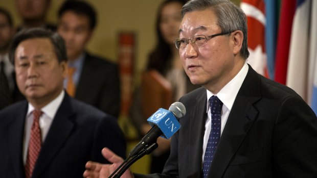 South Korea's Foreign Minister Kim Sung-hwan speaks at a news conference after the UN Security Council, with South Korean Ambassador Kim Sook in the background.
