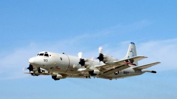 A US Navy P-3 Orion shortly after takeoff. The US Navy decided that long-range naval aircraft were a more efficient way to search for missing Malaysia Airlines Boeing 777 in the Indian Ocean. 