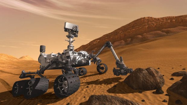 Finding out about Mars ... in this artist's rendering, the Mars Science Laboratory Curiosity rover examines a rock on Mars.