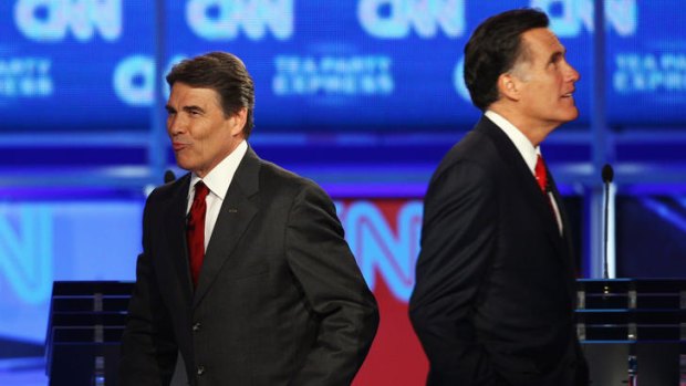Pot shots &#8230; Rick Perry, left and Mitt Romney at the latest debate.