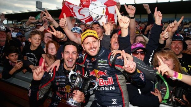 Jamie Whincup and Paul Dumbrell celebrate after they won the Sandown 500 last year.