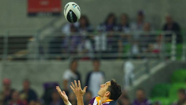 Flying high: Billy Slater leaps for the ball during Storm's win over Newcastle.